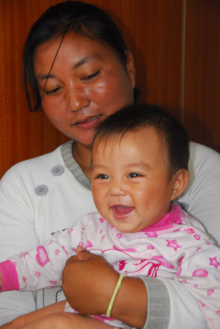 云南16名被解救婦女兒童返回家鄉(xiāng)