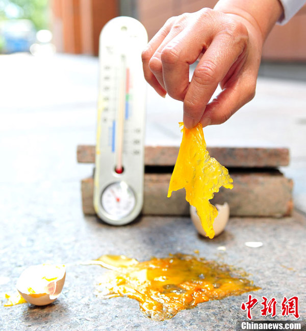 上海連續7天溫度超38℃ 滾燙地面能“煎”雞蛋