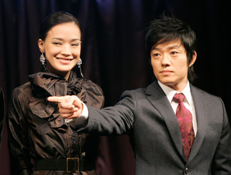 Actress Shu Qi (L) and South Korean actor Lee Bum-su attend a photocall prior to a news conference to promote their new movie