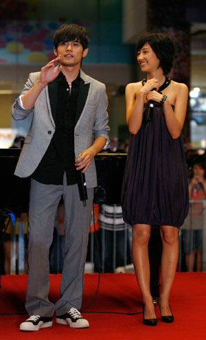 Singer and actor Jay Chou (L) of Taiwan and actress Kwai Lun-mei of Hong Kong arrive for the premiere of his new film