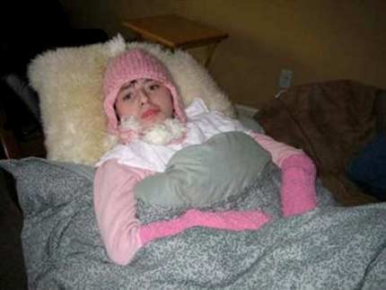 Ashley, who cannot walk or talk and has the mental ability of a baby, is seen bundled up during a power outage in a December 2006 photo courtesy of her parents. 